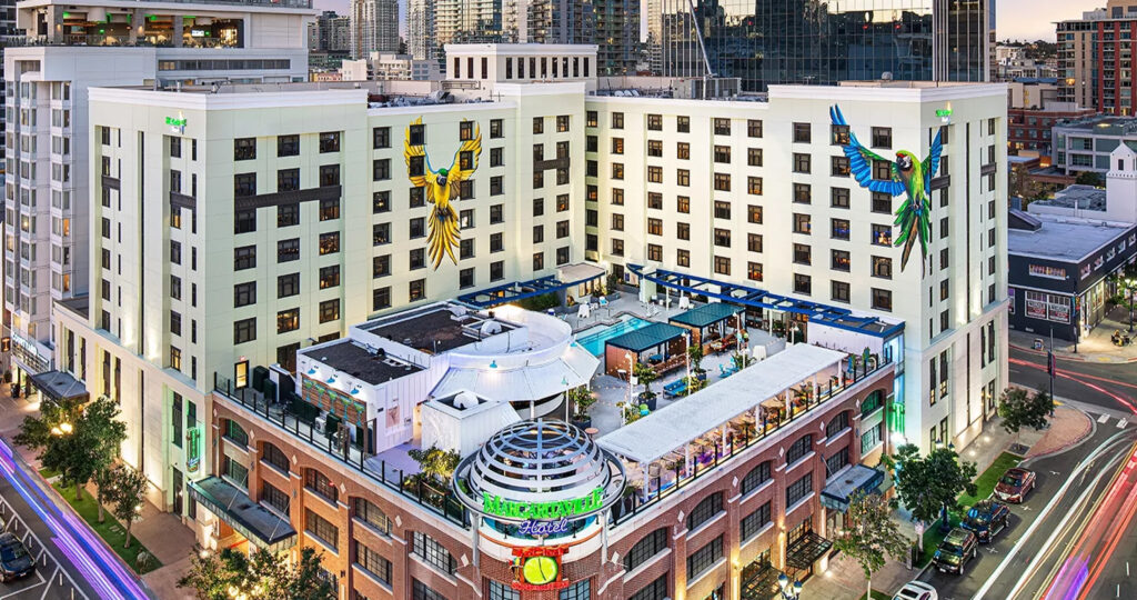 a building with a pool and a large bird on the side