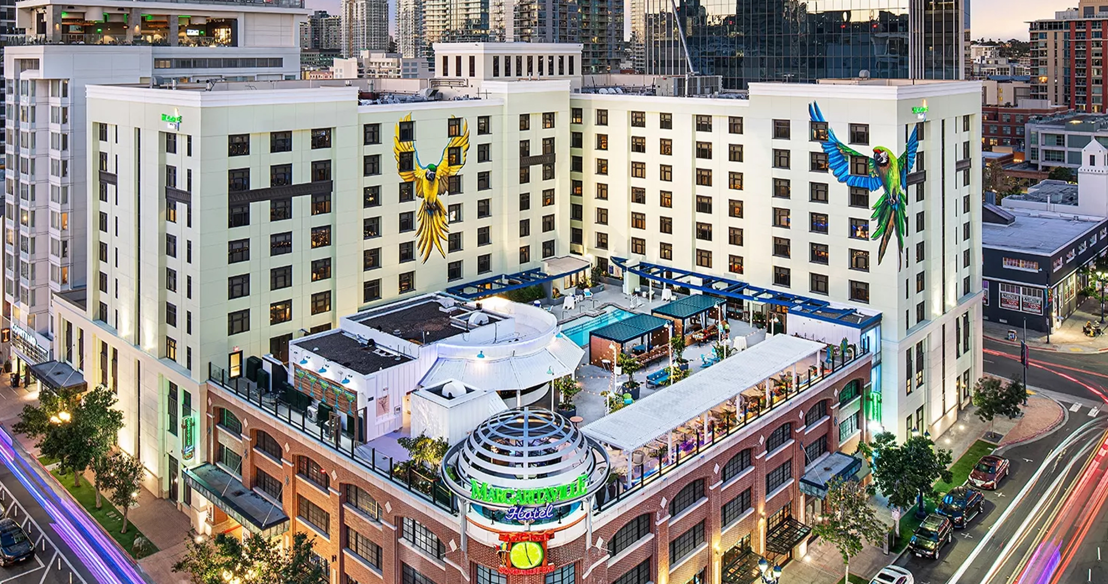 a building with a pool and a large bird on the side