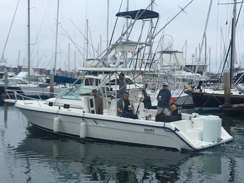 a boat is docked next to a body of water