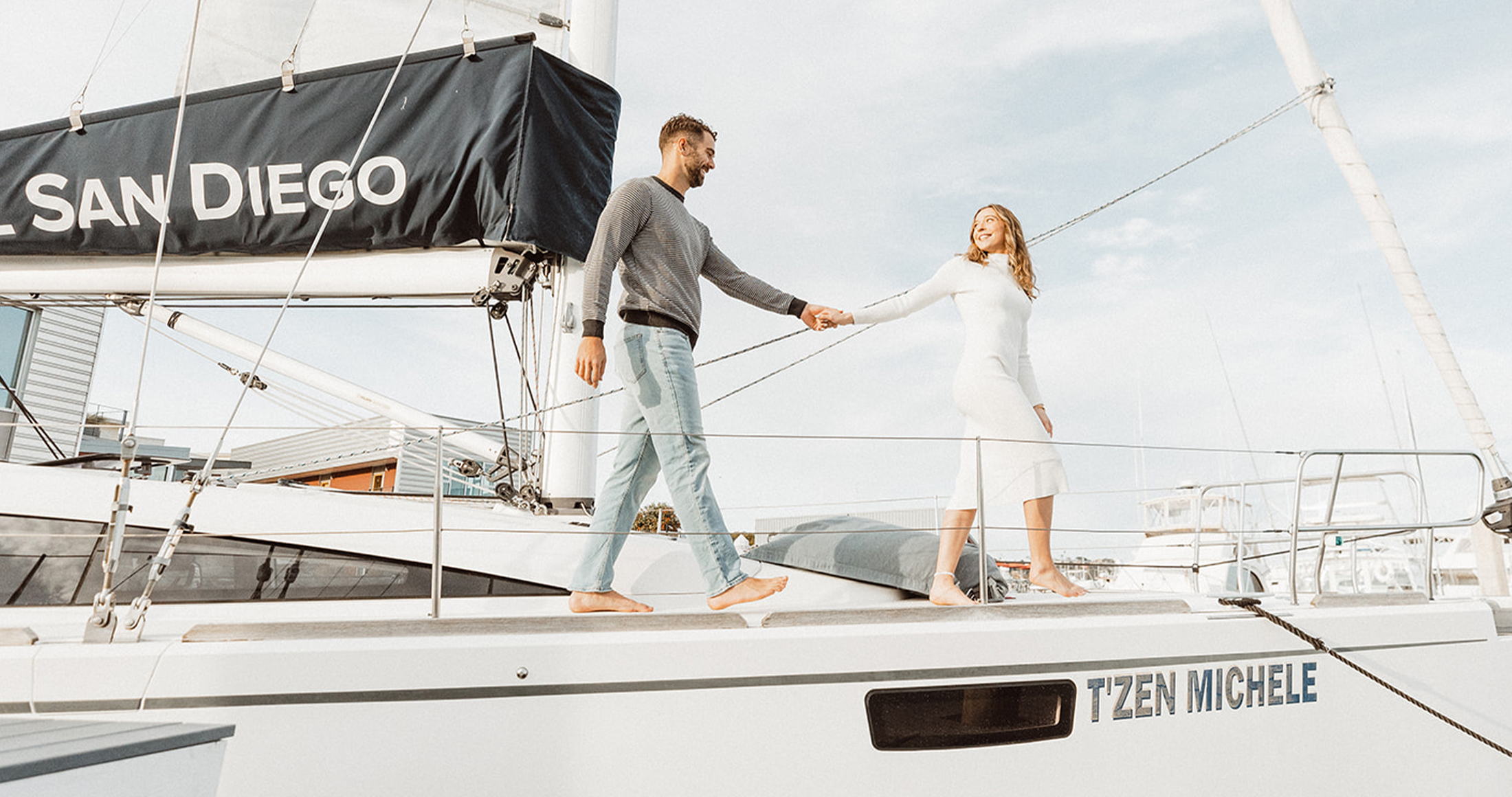 a man and woman holding hands on a boat